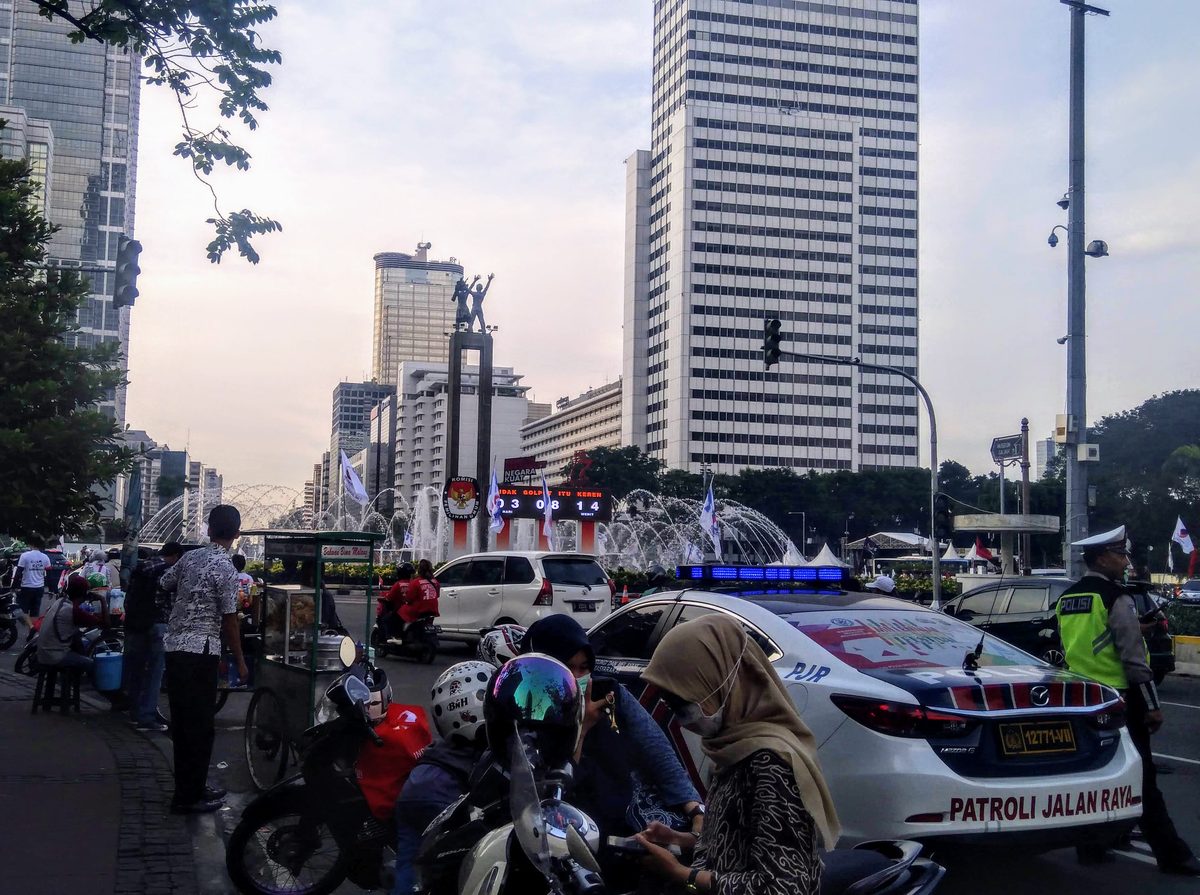 The Welcome Monument at Bundaran HI in April 2019, with an election countdown display
