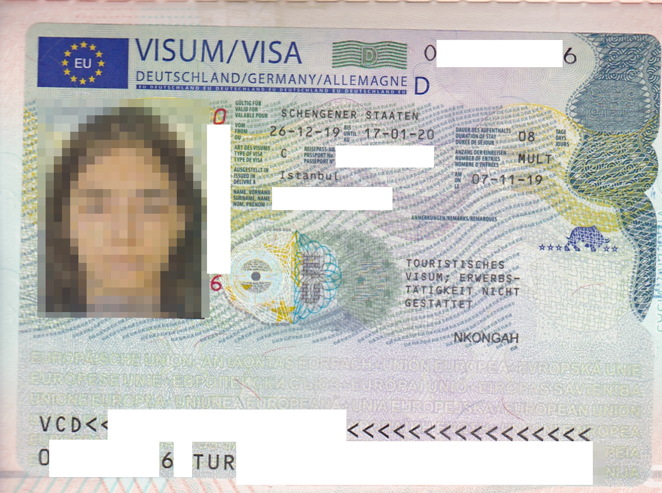 A German Schengen visa sticker inside a passport